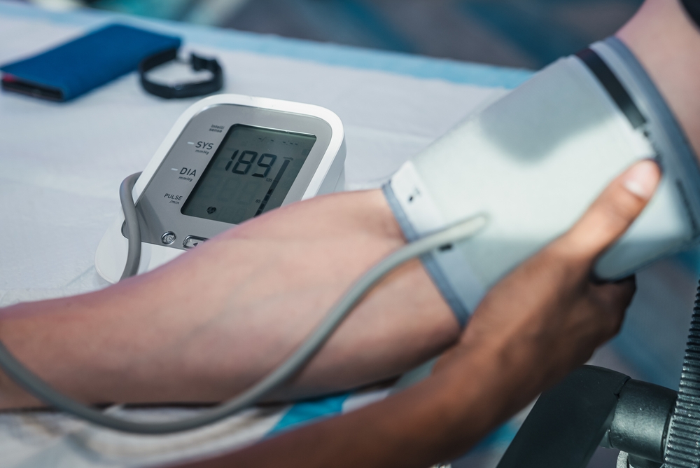 A healthcare professional checks a patient's blood pressure