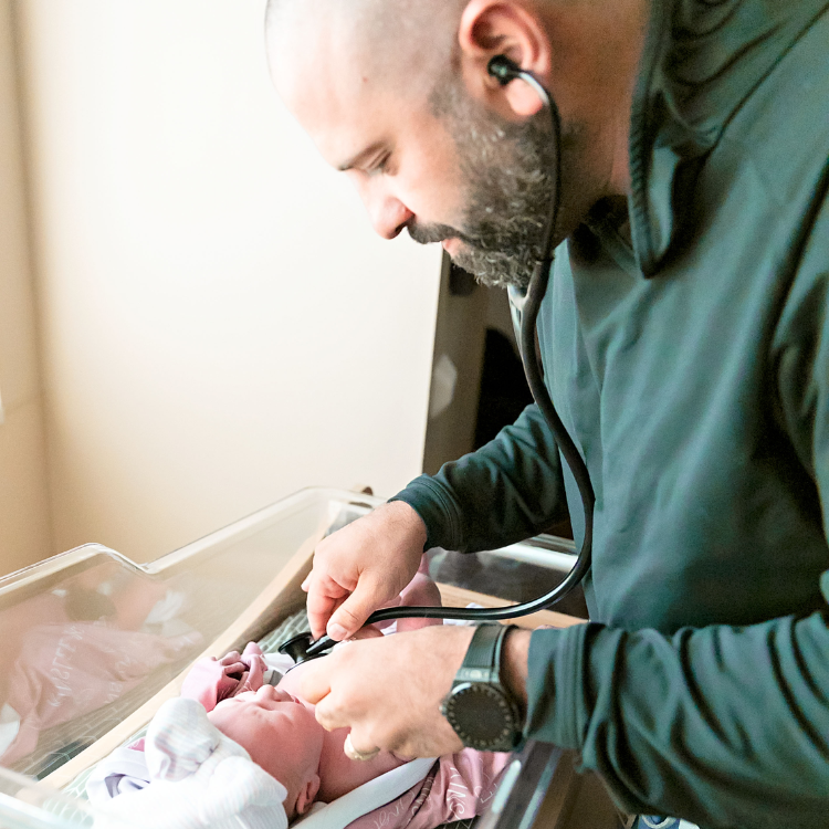 Dr. Shadid examines a baby.