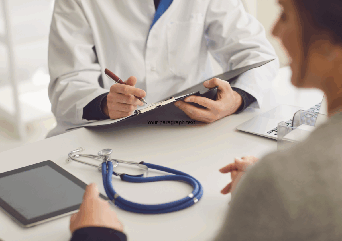 Close-up of family doctor and patient's hands across a table during a medical consultation.